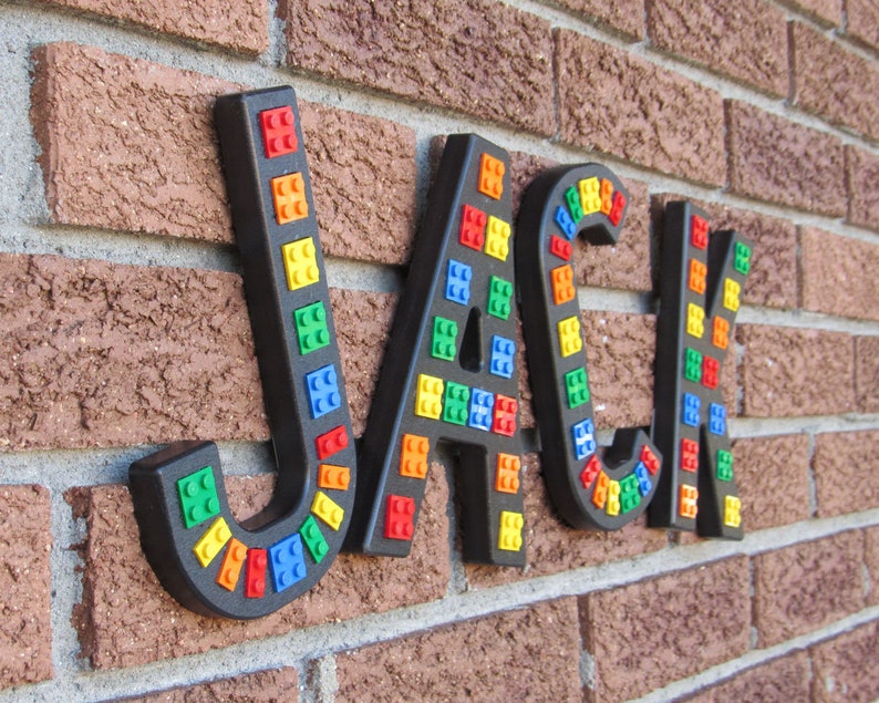 Black Brick Script Wall Letters embedded.