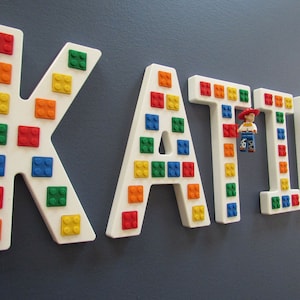 White "Brick Script" Wall Letters, embedded with real bricks.