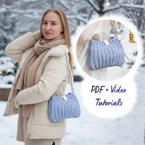May include: A light blue crochet handbag with a shoulder strap. The bag has a ribbed texture and a small leather tag. The image also includes the text "PDF + Video Tutorials". The bag is shown in two different views.