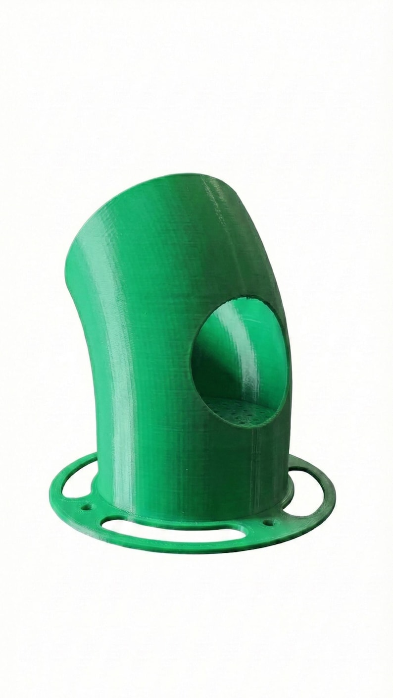 K&ouml;nnte beinhalten: Ein leuchtend gr&uuml;ner, 3D-gedruckter Vogelfutterspender mit gebogenem K&ouml;rper und kreisf&ouml;rmiger &Ouml;ffnung. Der Futterspender hat einen runden Sockel mit drei gebogenen Aussparungen. Das Design ist modern und funktional.