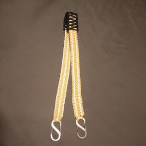 51inch orange and white paracord strap with black pad