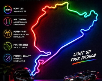 May include: A Nürburgring LED neon sign featuring a multi-colored race track outline. The sign displays text including Nürburgring LED Neon Sign, Premium Race Track Wall Decor, and Light Up Your Passion. A racing helmet and car model are visible below.