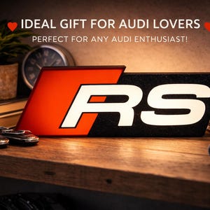 Peut inclure: Une tasse en céramique blanche avec une anse noire et le texte "But First, Coffee" en gras noir. La tasse est posée sur un fond flou, soulignant son design épuré.