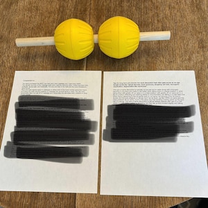 May include: Two yellow massage balls attached to a wooden dowel. The balls are designed to help relieve back pain. The text on the page discusses the benefits of using the balls for back pain relief.