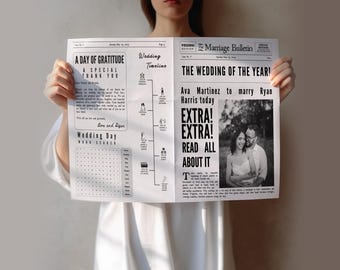 May include: A person holds a wedding announcement designed like a newspaper. The headline reads "The Wedding of the Year!" featuring Ava Martinez and Ryan Harris. The text includes "Extra! Extra! Read All About It."