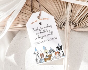 May include: White thank you tag with orange text that reads "You're Paw-some!" and "Thanks for making our birthday so doggone great! Teagan & Tanner". The tag features a paw print and a cartoon illustration of six dogs wearing party hats.