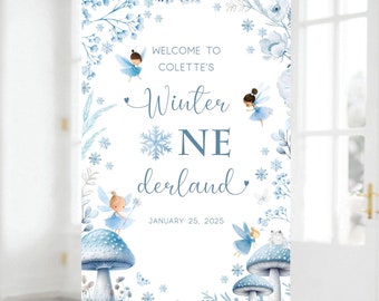 May include: Welcome to Colette's Winter One Derland, a blue and white winter wonderland themed party invitation with a snowflake and fairy illustrations. The date January 25, 2025 is printed on the bottom.