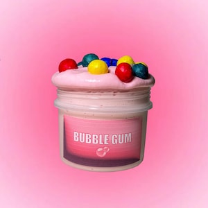 Slime de chewing-gum - slime rose d'argile de chewing-gum avec des additifs multicolores de chewing-gum