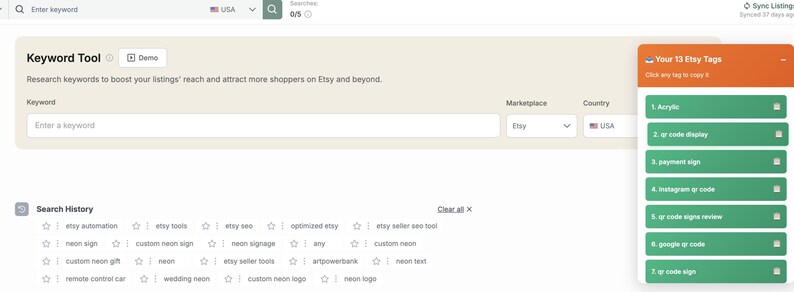 May include: Screenshot of an Etsy keyword tool interface. The page includes a search bar, search history, and a section titled "Your 13 Etsy Tags." The tags are listed in green boxes with white text. The top of the page has the text "Keyword Tool."