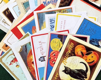 May include: A collection of vintage-style Halloween postcards featuring colorful illustrations of black cats, jack-o'-lanterns, witches, and moons. The cards display various festive greetings and imagery, arranged in a fan-like overlapping display.