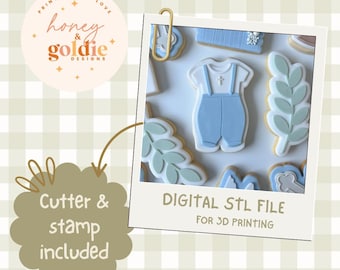 May include: A collection of decorated cookies, including a baby outfit, leaves, and other shapes. The cookies are light blue, white, and beige. The image is labeled "DIGITAL STL FILE FOR 3D PRINTING". The text "Cutter & stamp included" is also present.