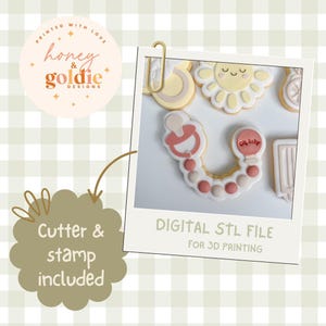 May include: A digital STL file for 3D printing featuring a cookie cutter and stamp design. The image displays a dummy-shaped cookie with pink and beige icing, alongside other baby-themed shapes like a sun, all labelled as a digital STL file.