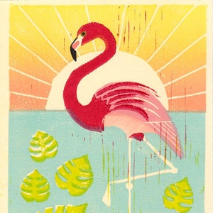 May include: A pink flamingo stands on one leg in a turquoise blue water setting with a yellow sun rising in the background.  There are six green tropical leaves scattered around the flamingo.