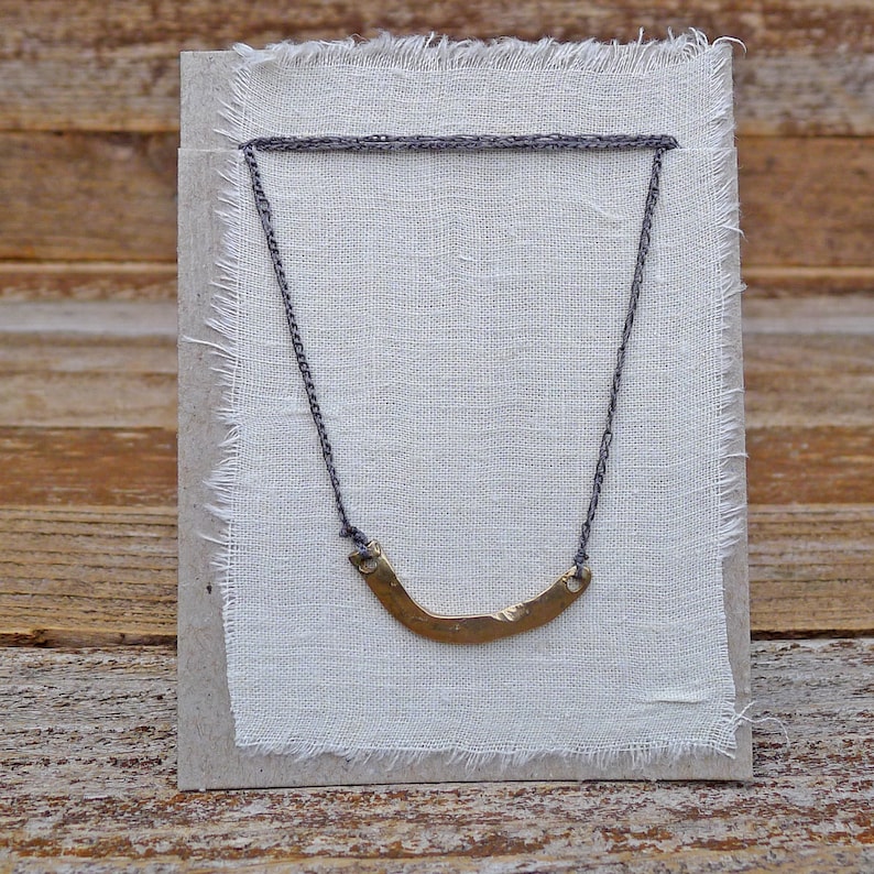 hand cast yellow bronze charm on adjustable crocheted cord basin necklace by kata golda