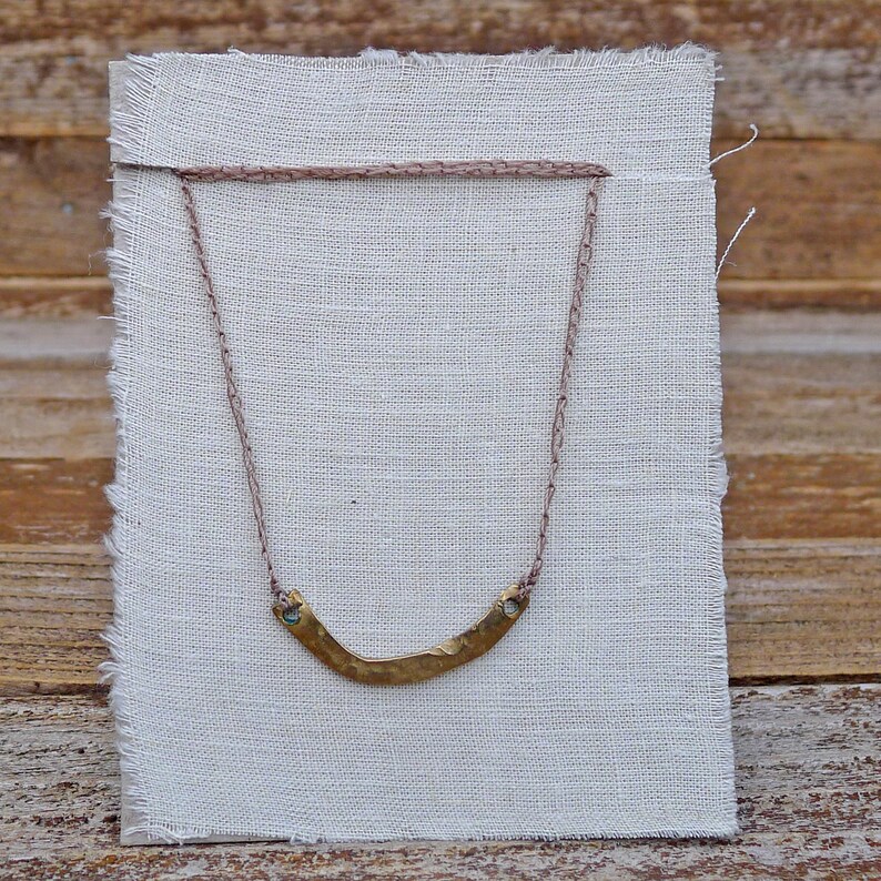 hand cast yellow bronze charm on adjustable crocheted cord basin necklace by kata golda