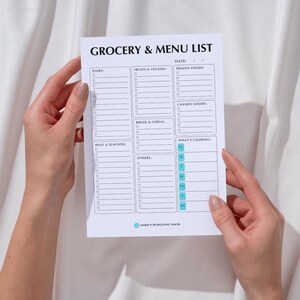 May include: A printable grocery and menu list with checkboxes for dairy, fruits and veggies, frozen foods, canned goods, bread and cereal, meat and seafood, and others. The list also includes a section for meal planning with boxes for each day of the week.