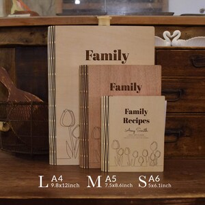 May include: Wooden recipe books in various sizes, labeled L, M, and S. The largest book is 25x30.5cm, with the word "Family" engraved on the cover. The smallest book is labeled "Family Recipes" with the name Amy Smith.