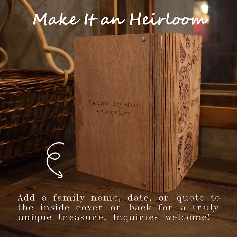 May include: A wooden box with the text "Make It an Heirloom" and "The Secret Ingredient is Always Love." The box has decorative etched designs on the side. The text at the bottom says, "Add a family name, date, or quote to the inside cover or back for a truly unique treasure."