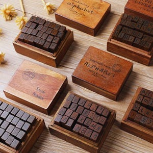 28 piezas de sellos del alfabeto de madera vintage con letras de goma