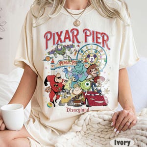 Vintage Pixar Pier Disneyland Shirt, Disneyland Pixar Fest 2025 Shirt, Meet me at Pixar Pier Disney Pixar Characters Tee,Disneyland Trip Tee