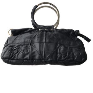 May include: A black leather handbag featuring a structured rectangular body with geometric paneling and two circular metal handles. The top handle is engraved with the word DIESEL, and the bag includes side pockets with gathered detailing and silver-tone hardware accents.