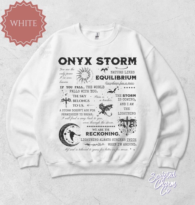May include: White sweatshirt with the text "ONYX STORM" and various graphics, including a sun, bats, and a crescent moon. The design includes phrases like "The Sky Belongs To Us" and "We Are The Reckoning."