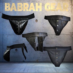 May include: Collection of black leather jockstraps with various designs. One features a zipper, others have button closures, and one has a strap design. The text "BABRAH GEAR" is displayed in gold letters at the top.