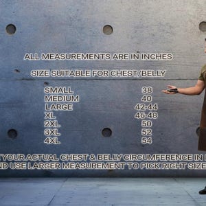 May include: A man wearing a brown leather apron, standing next to a chart with chest/belly measurements in inches. The chart lists sizes from Small (38 inches) to 4XL (54 inches). The text reads: "Measure your actual chest & belly circumference in inches and use larger measurement to pick right size."