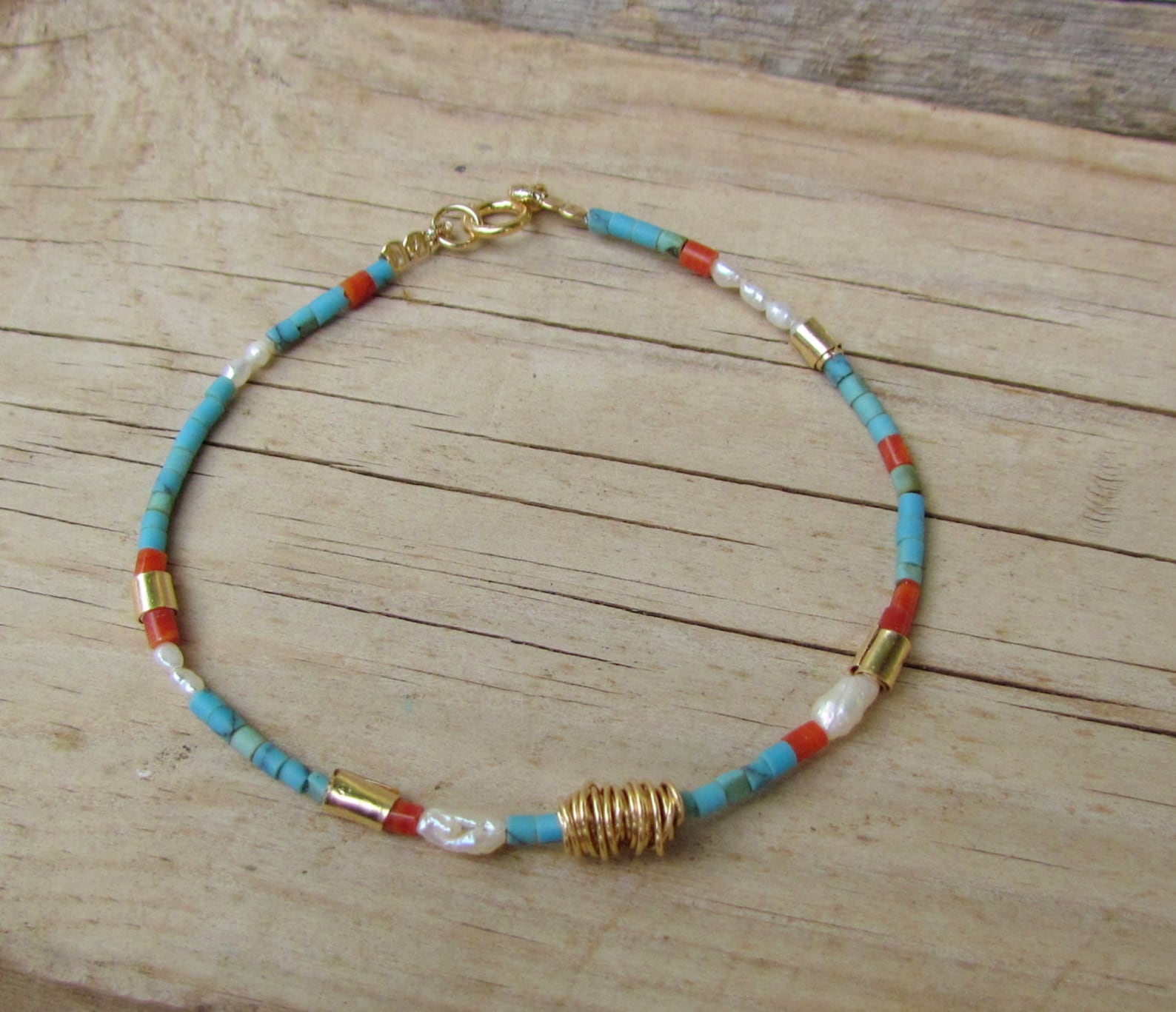 JP545 - Gold bracelet with coral pearls and turquoise. main image 1