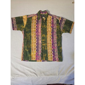 May include: Short-sleeved button-down shirt with a colorful pattern. The shirt features vertical stripes in shades of green, yellow, and purple. The shirt has a collar and the brand name "PALM" is visible on the collar.
