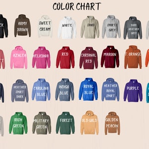 a large group of different colored sweatshirts on a white background