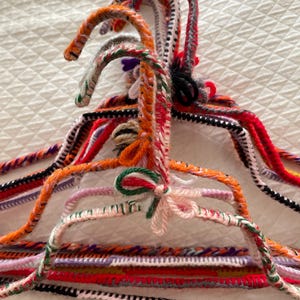 9 metal, very strong, vintage knitted clothes hangers