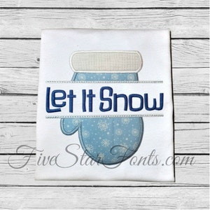May include: White t-shirt with a blue and white embroidered mitten and the text "Let It Snow" in blue.