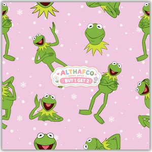 May include: A seamless pattern featuring green frogs on a light pink background with white polka dots and small snowflakes. A central label displays the text ALTHAFCO seamless pattern BUY 1 GET 2 with small flower icons on the sides.