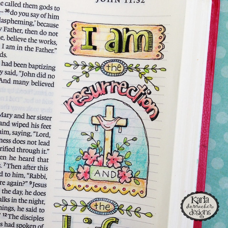 May include: A hand-drawn illustration of a cross with a crown of thorns and the words "I am the resurrection and the life" in a colorful, whimsical style.
