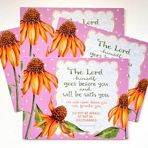 May include: Pink greeting cards with white polka dots and watercolor illustrations of orange and yellow coneflowers. The cards feature the text "The Lord himself goes before you and will be with you."