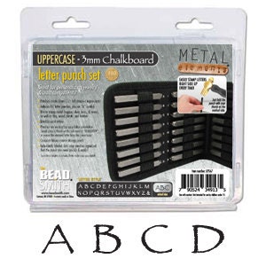 May include: A set of 26 uppercase letter punches in a black case. The punches are made of metal and are 3mm in size. The case has a label that says "UPPERCASE - 3mm Chalkboard letter punch set". The case also has a label that says "METAL elements".