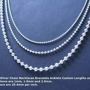 May include: Three silver chains of different sizes, 1mm, 1.5mm, and 2.5mm, shown on a dark blue background. Sterling Silver Chain Necklaces Bracelets Anklets Custom Lengths and Sizes. Shown above are 1mm, 1.5mm and 2.5mm. Note: There are 25.4mm per inch.