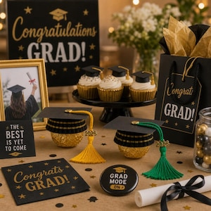 May include: A graduation-themed display featuring cupcakes with mortarboard toppers, decorative candies, and graduation-themed signs. The signs read "Congratulations GRAD!" and "The Best Is Yet To Come." There are also graduation cap-shaped candies with tassels.