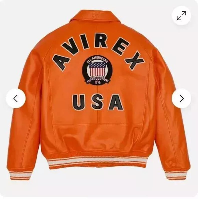 May include: Orange leather bomber jacket with a black and white "AVIREX" logo and a patch with the text "ALL AMERICANS ESTABLISHED 1975 USA".