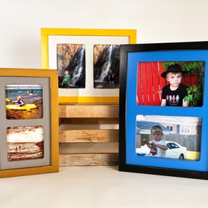 May include: Three picture frames with different colored frames and matting. The frames are all made of wood and have a simple design. The top frame is yellow with a white mat and two photos of waterfalls. The middle frame is gold with a gray mat and two photos of a beach scene. The bottom frame is black with a blue mat and two photos of a boy.