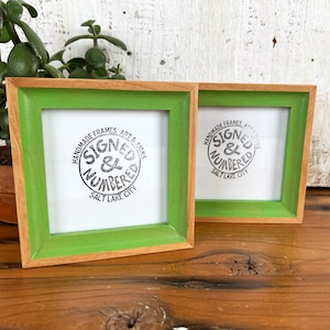 May include: A rustic wooden sign with the text "Welcome to our home" in white lettering. The sign features a distressed finish and a simple, inviting design, perfect for a front porch or entryway.