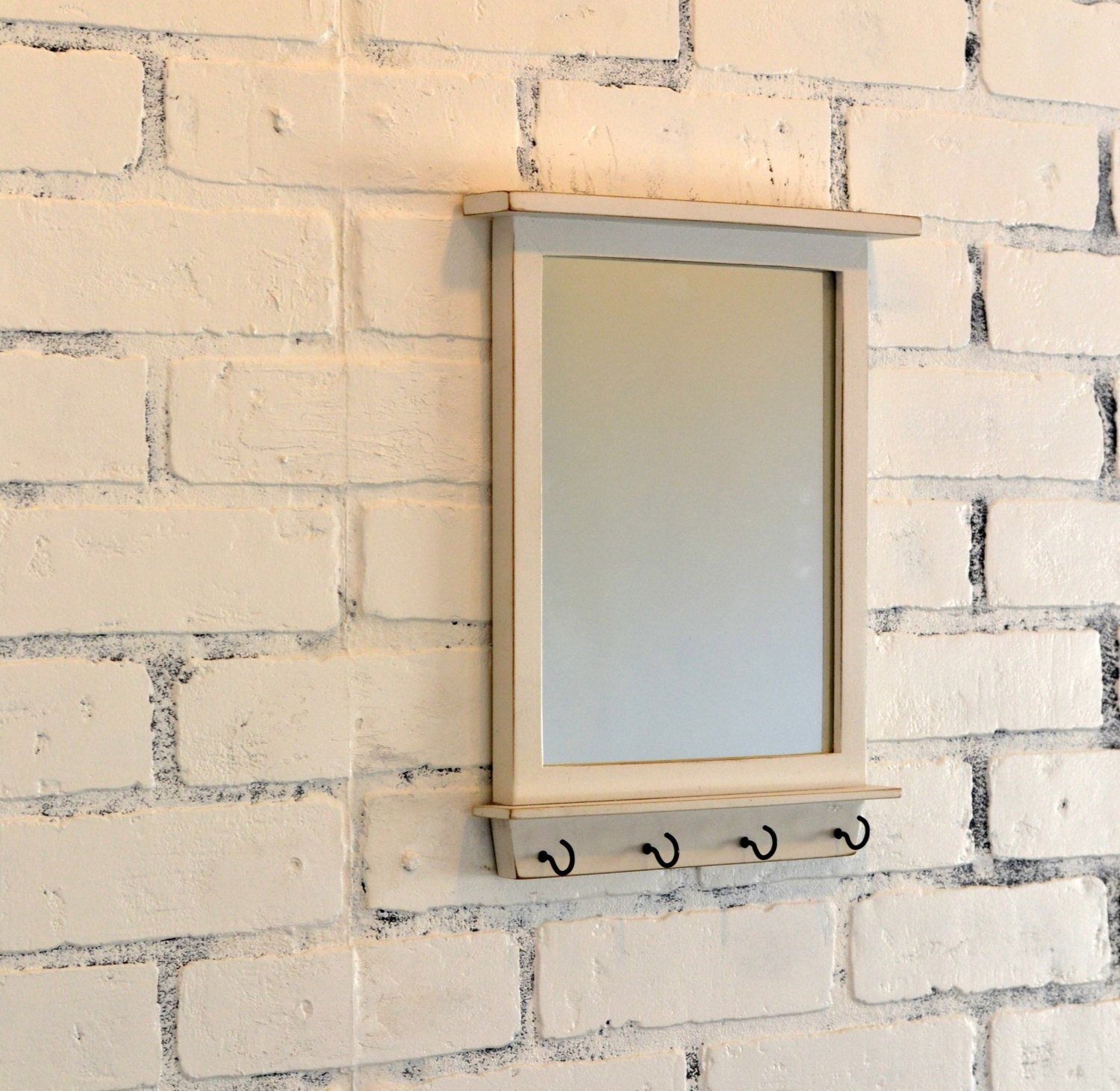 I removed those doors and decided to use them as the frame for my new entryway mirror. entryway mirror with four key holder