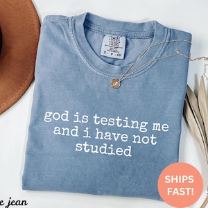 Comfort Colors® God Is Testing Me And I Have Not Studied Shirt, Funny Faith Humor, Religious Gift, Spiritual Joke, Christian Humor
