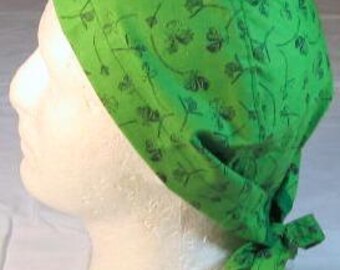 Handmade St Patrick Day Medical Scrub Hat with Black Clover on a Light Green Background