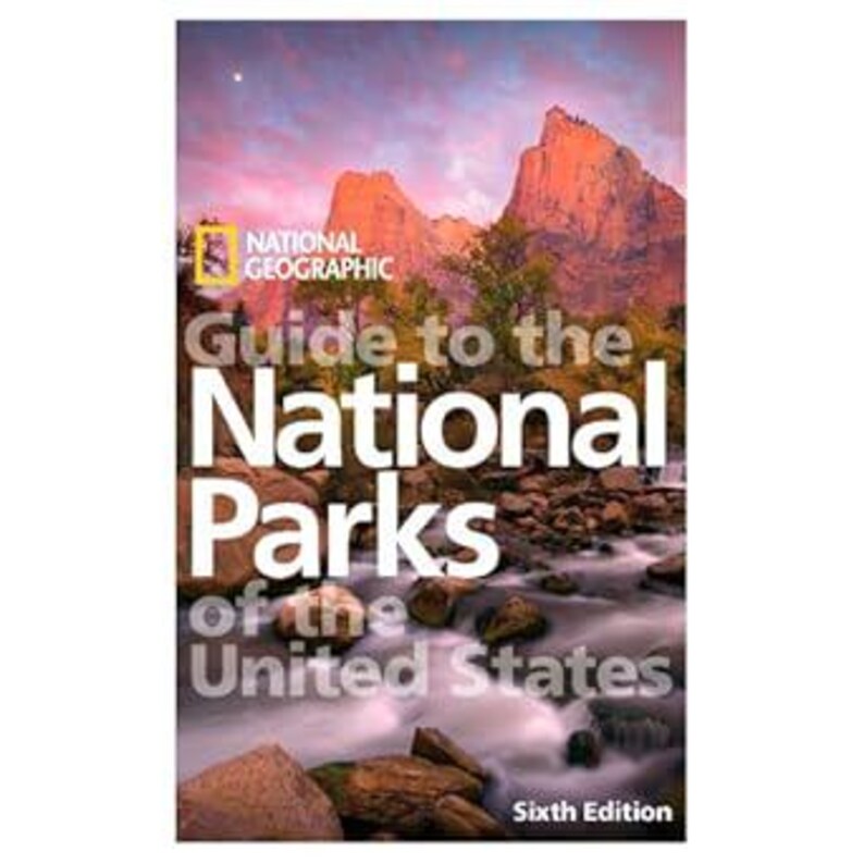 May include: A National Geographic book titled "Guide to the National Parks of the United States." The cover shows a mountain range and river scene. The title text is in white and grey.