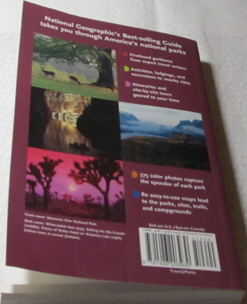 May include: A National Geographic guide to America's national parks. The cover features images of deer, landscapes, and trees. The back cover includes text about the guide's features, including colour photos and maps.