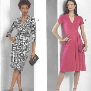 May include: Vogue Patterns sewing pattern featuring two dress designs. One dress is a black and white geometric print with a wrap style. The other is a solid pink wrap dress. The pattern size is A5 (6-8-10-12-14).