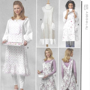 May include: McCall's sewing pattern M8598. The pattern features aprons with various designs, including a white apron with floral patterns and a ruffled hem. The size range is XS-XL. Designed and printed in the USA.