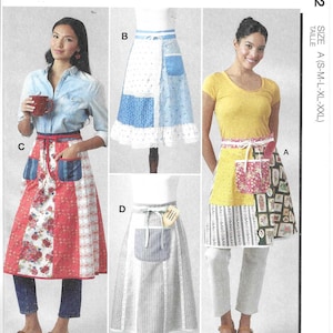 May include: McCall's sewing pattern M8572 featuring four apron designs. Aprons include various patchwork patterns, floral prints, and striped fabrics. The pattern includes sizes A (S-M-L-XL-XXL). Designed and printed in the USA.
